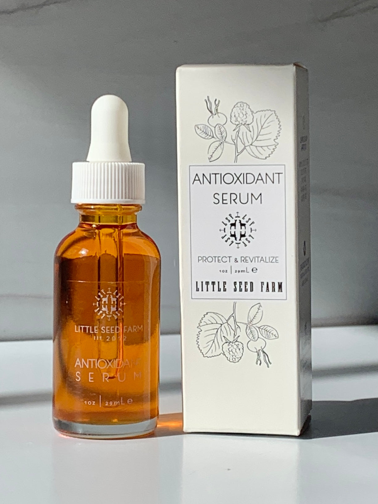 antioxidant facial serum in glass bottle