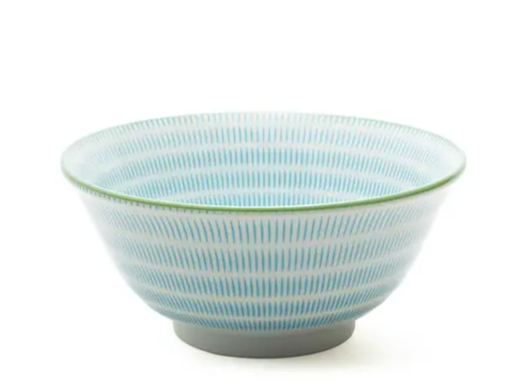 Ceramic bowl with blue and white pattern on a white background
