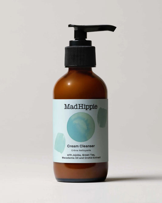 Amber glass bottle with pump of MadHippie Cream Facial Cleanser.