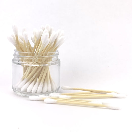 bamboo and cotton swabs in a jar